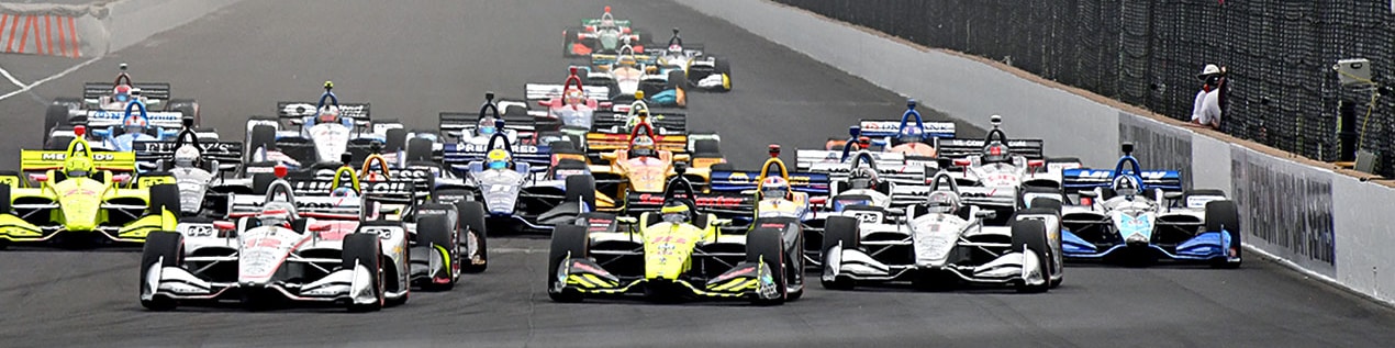 indy cars racing to through the start line Bloomington
